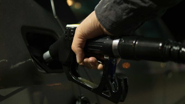 Person holding gasoline nozzle